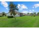 Home features a backyard with a large grassy area at 5307 Applegate Ct, Bradenton, FL 34211