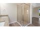 Walk-in shower with glass enclosure and neutral tile at 5307 Applegate Ct, Bradenton, FL 34211