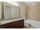 Bathroom with double vanity, granite countertop, and shower/tub combo at 5307 Applegate Ct, Bradenton, FL 34211