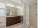 Double vanity bathroom with large shower and granite countertop at 5307 Applegate Ct, Bradenton, FL 34211