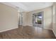 Bright bedroom with wood-look floors and sliding glass door to patio at 5307 Applegate Ct, Bradenton, FL 34211
