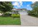 Single story home with a white garage door at 5307 Applegate Ct, Bradenton, FL 34211