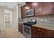 Modern kitchen features stainless steel appliances and granite countertops at 5307 Applegate Ct, Bradenton, FL 34211