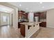 Open kitchen with granite countertops and a large island at 5307 Applegate Ct, Bradenton, FL 34211