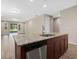Kitchen island with granite countertop and stainless steel dishwasher at 5307 Applegate Ct, Bradenton, FL 34211