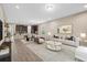 Open living room with neutral color palette and ample natural light at 5307 Applegate Ct, Bradenton, FL 34211