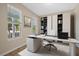Home office with built in shelving and large windows at 5307 Applegate Ct, Bradenton, FL 34211