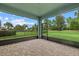 Screened porch with paver floor and view of backyard at 5307 Applegate Ct, Bradenton, FL 34211