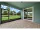 Screened porch with paver floor and sliding glass doors at 5307 Applegate Ct, Bradenton, FL 34211