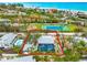 Aerial view showing house, pool, and tennis court nearby at 531 Edlee Ln, Longboat Key, FL 34228