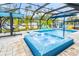 Refreshing pool and spa with colorful seating at 531 Edlee Ln, Longboat Key, FL 34228