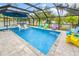 Refreshing pool and spa with colorful seating at 531 Edlee Ln, Longboat Key, FL 34228