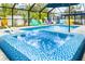 Relaxing spa with blue tile and bubbling water at 531 Edlee Ln, Longboat Key, FL 34228