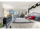 Main bedroom with large bed and patio access at 6114 43Rd W St # 104E, Bradenton, FL 34210