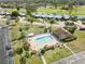 Community pool with surrounding patio and lounge chairs at 6114 43Rd W St # 104E, Bradenton, FL 34210