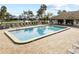 Inviting community pool with ample deck space for lounging at 6114 43Rd W St # 104E, Bradenton, FL 34210