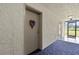 Condo hallway with carpet and door at 6114 43Rd W St # 104E, Bradenton, FL 34210