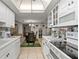 White kitchen with an eat-in area, and stainless steel appliances at 6114 43Rd W St # 104E, Bradenton, FL 34210