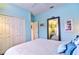 Bedroom with a large mirror, double closet and white walls at 6611 Pinefeather Ct, Bradenton, FL 34203