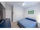 Spacious bedroom with large TV and double closet at 6614 162Nd E Pl, Parrish, FL 34219