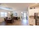 Open dining area with wood-look floors and kitchen access at 6614 162Nd E Pl, Parrish, FL 34219