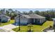 Single story home with a three car garage and spacious front yard at 6614 162Nd E Pl, Parrish, FL 34219