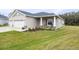 Two-car garage and nicely landscaped front yard at 6614 162Nd E Pl, Parrish, FL 34219