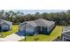 Single story house with three-car garage, and nicely landscaped yard at 6614 162Nd E Pl, Parrish, FL 34219