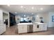 Open concept kitchen features a large island and stainless steel appliances at 6614 162Nd E Pl, Parrish, FL 34219