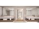 Spa-like bathroom with double vanities and a large soaking tub at 70 Avenida Veneccia # 202, Sarasota, FL 34242