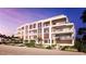 Modern beachfront building with pool and patio area at 70 Avenida Veneccia # 202, Sarasota, FL 34242