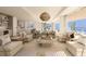 Bright and airy living area with open floor plan and ocean views at 70 Avenida Veneccia # 202, Sarasota, FL 34242