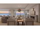 Living room with fireplace and access to balcony and ocean views at 70 Avenida Veneccia # 202, Sarasota, FL 34242