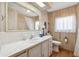 Bathroom featuring white tiled countertops and sink, with a toilet and shower/tub combination at 703 Corsica Ct, Bradenton, FL 34207
