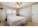 Well lit bedroom with white closet doors and a soft bed at 703 Corsica Ct, Bradenton, FL 34207