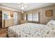 Bedroom with soft carpet, light wood paneling, and white window shades at 703 Corsica Ct, Bradenton, FL 34207