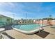 Inviting community pool with ample seating, perfect for relaxation and social gatherings under the clear sky at 703 Corsica Ct, Bradenton, FL 34207