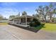 Charming single-story home featuring a covered carport and well-maintained landscaping in a quiet neighborhood at 703 Corsica Ct, Bradenton, FL 34207