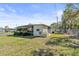 Exterior view of a single-story home with a carport and landscaped yard at 703 Corsica Ct, Bradenton, FL 34207