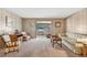 Cozy living room with comfortable seating and neutral-toned decor and carpet at 703 Corsica Ct, Bradenton, FL 34207