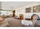 Living room with a wide entrance, large windows, and cozy furniture at 703 Corsica Ct, Bradenton, FL 34207