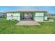 Charming poolside pavilion with seating, perfect for enjoying shade and refreshments while overlooking the community pool at 703 Corsica Ct, Bradenton, FL 34207