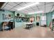 Spacious recreation room featuring versatile space for activities, bookshelves, decor, and a cozy atmosphere at 703 Corsica Ct, Bradenton, FL 34207