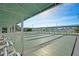 A view of the shuffleboard courts, covered for shade and including benches for viewers, at this community at 703 Corsica Ct, Bradenton, FL 34207