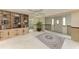 Entryway with built-in shelving and rug at 800 Riviera St, Venice, FL 34285