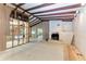 Spacious living room with exposed beams and a brick fireplace at 800 Riviera St, Venice, FL 34285