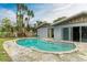 Kidney-shaped swimming pool in the backyard at 800 Riviera St, Venice, FL 34285