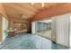 Sunroom features wood paneled walls and access to the backyard at 800 Riviera St, Venice, FL 34285