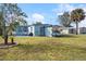 Large backyard with patio, shed, and kayaks at 8466 Maureen Ave, North Port, FL 34287