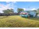 Grass yard with shed and kayaks, next to house at 8466 Maureen Ave, North Port, FL 34287